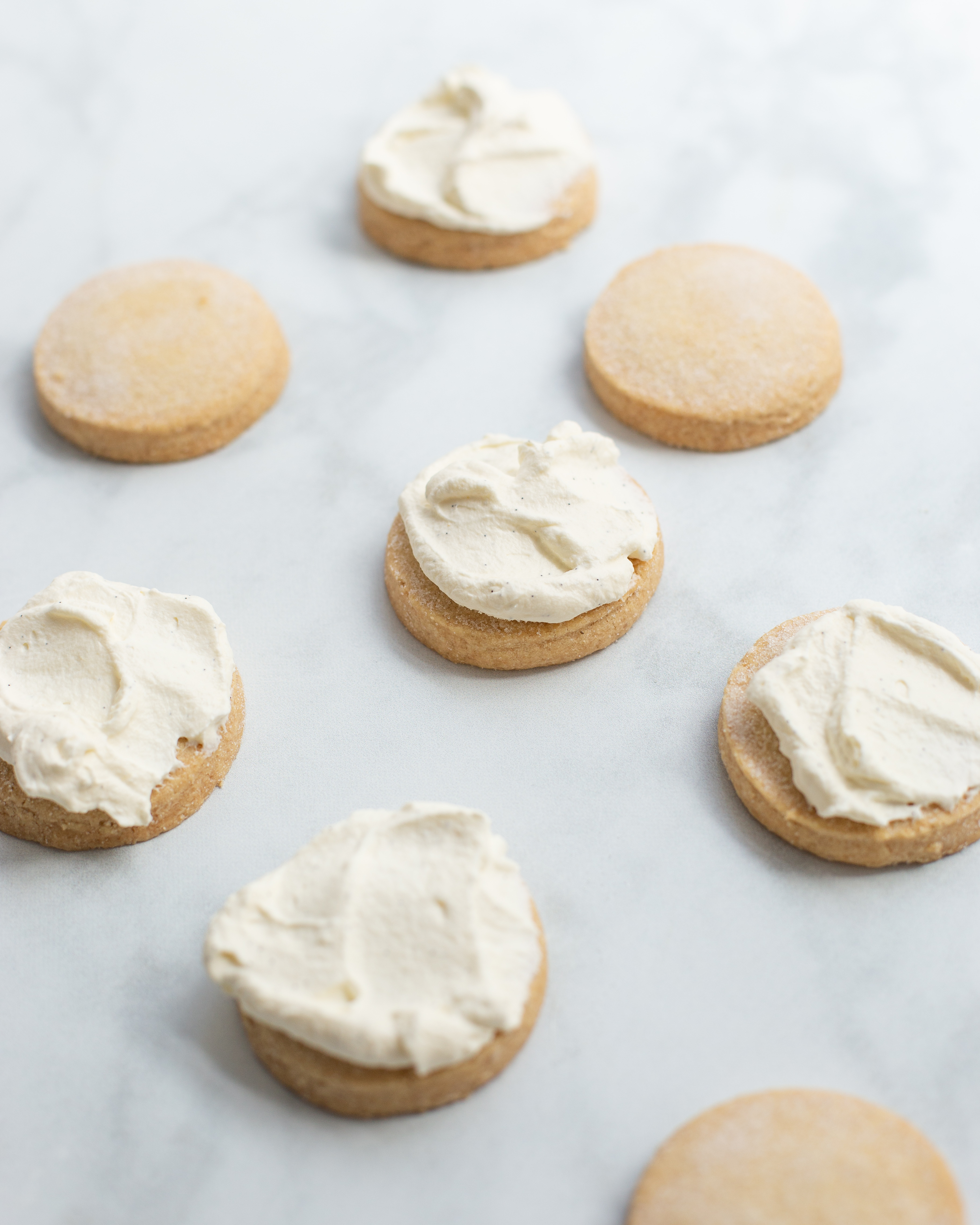 Top the shortbread rounds with a tablespoon of whipped cream.